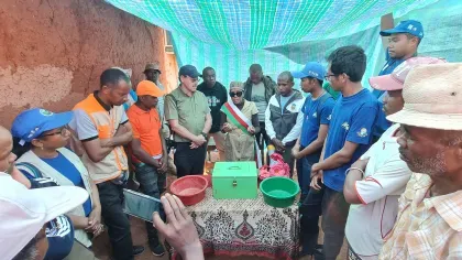 Discussions taking place between a large group in a Malagasy village