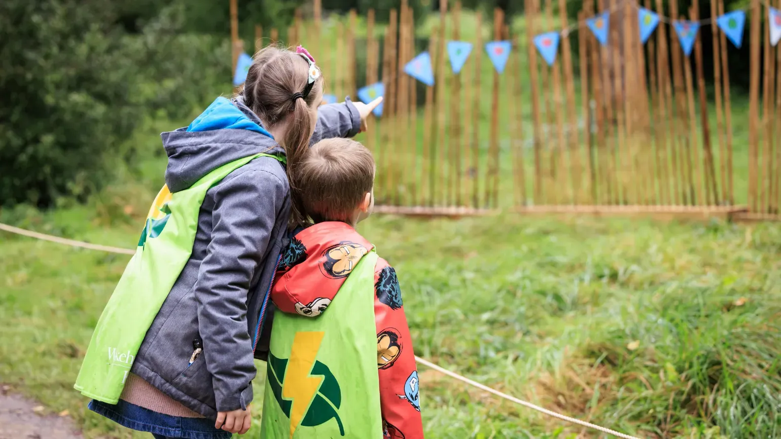 Brother and sister in Nature Heroes capes