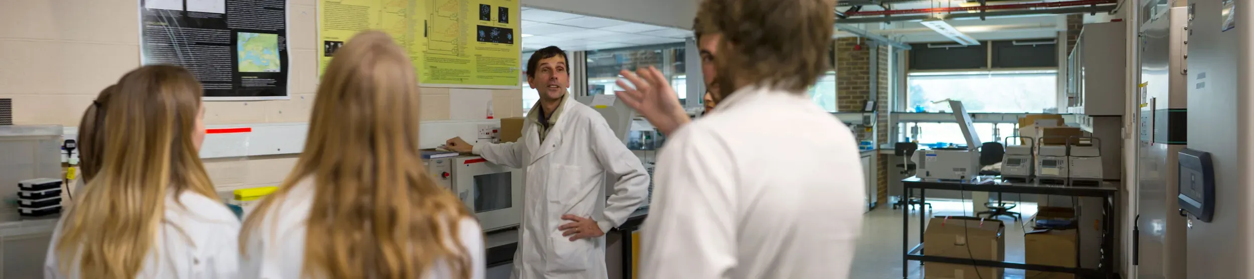 Group of students in a lab on a tour