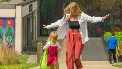 People playing in front of Wakehurst's Millennium Seed Bank